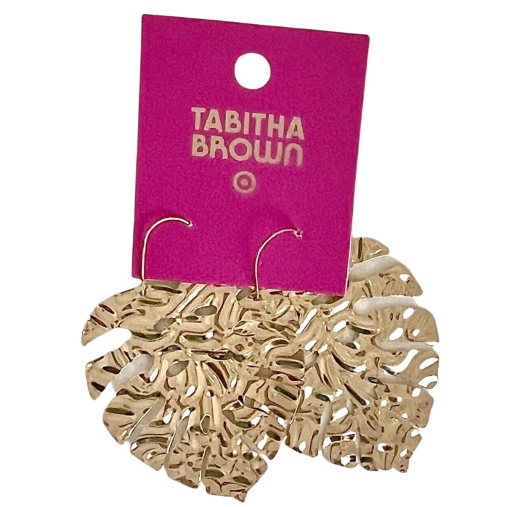 Gold palm leaf Tabitha Brown earrings.